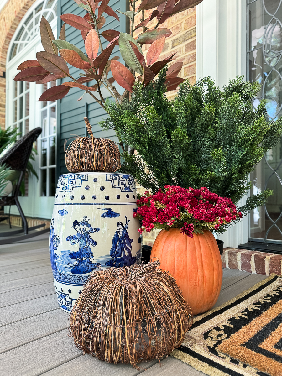 faux pumpkins on porch