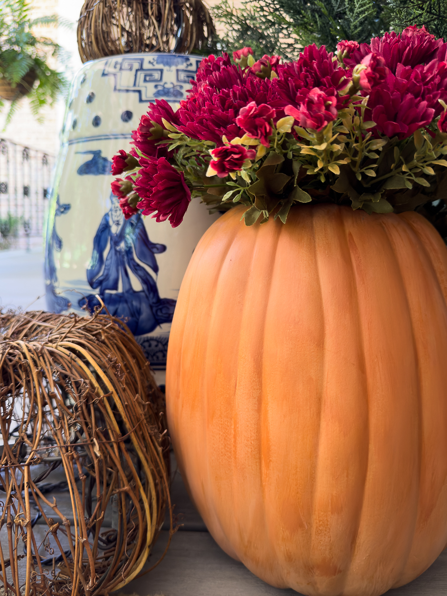 painted faux pumpkin with mums