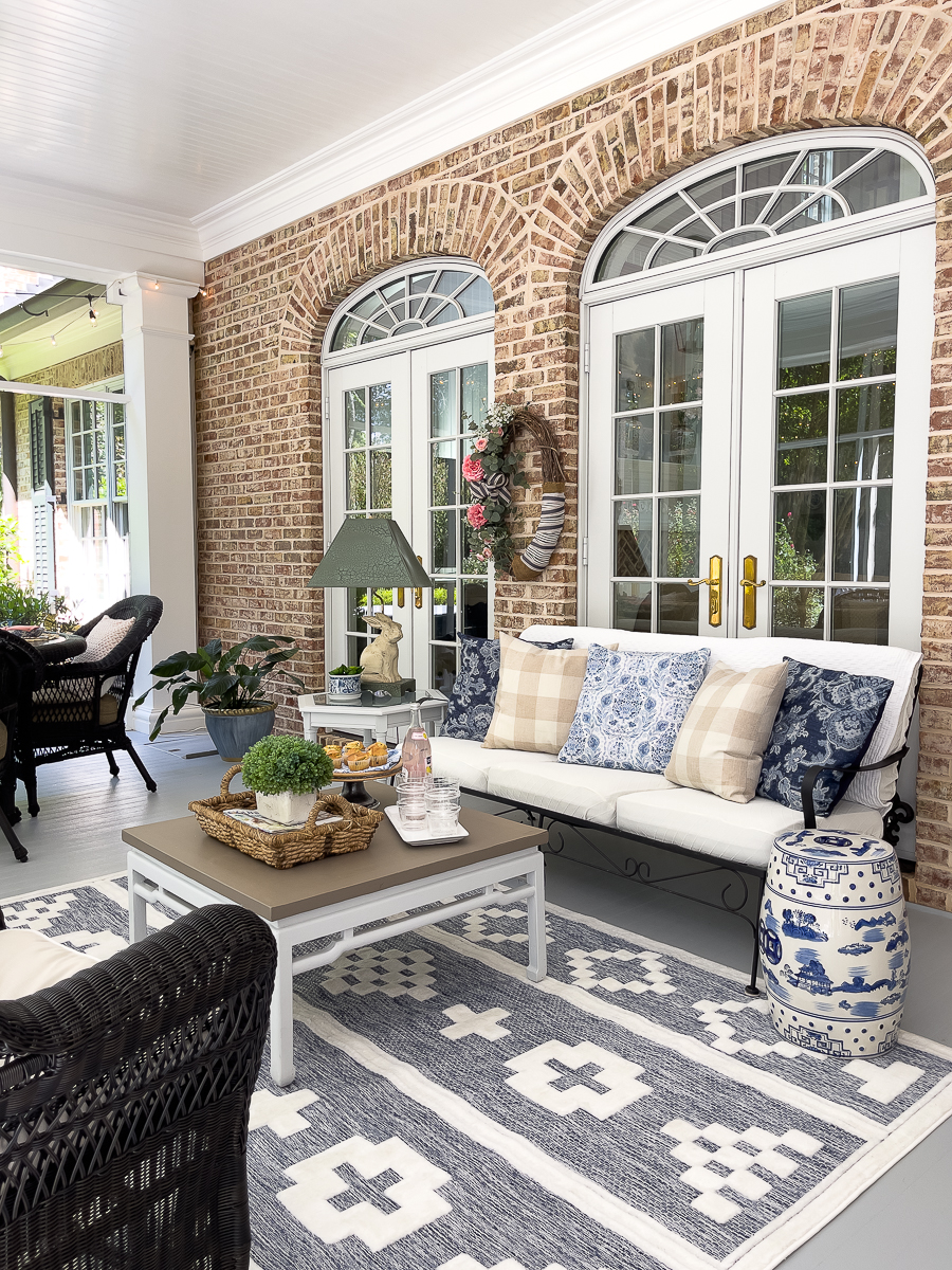 https://www.oursouthernhomesc.com/wp-content/uploads/screened-porch-blue-rug-1767.jpg