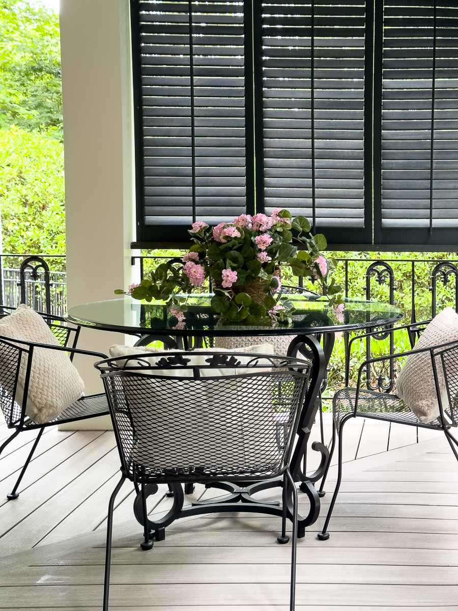 dining area on porch with wall shutters